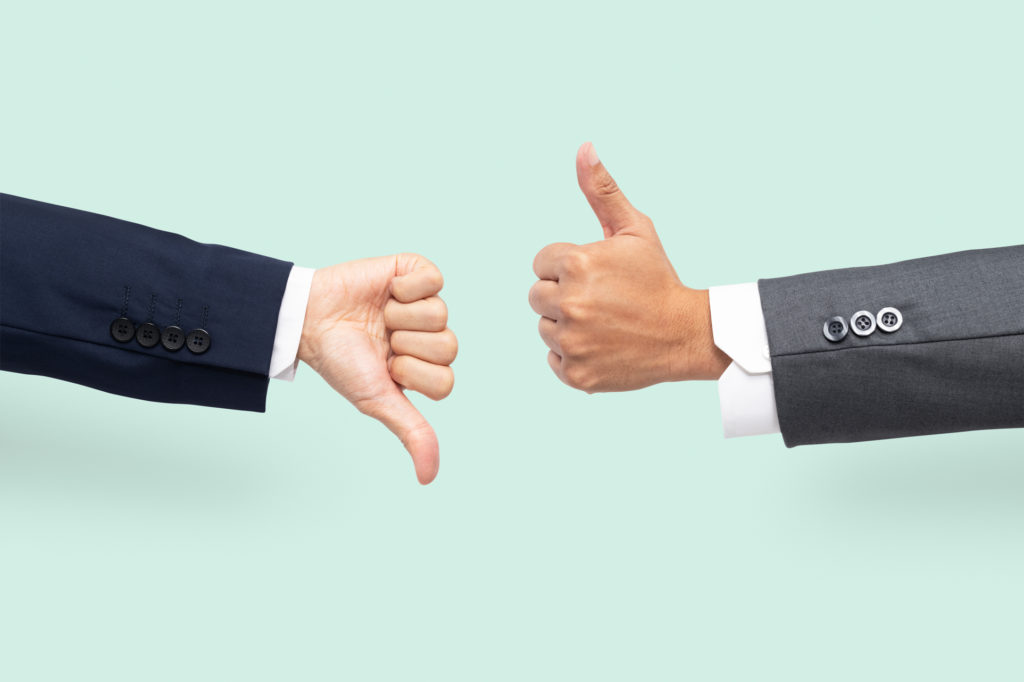 Thumbs up and down represent a disagree gesture because jobs can and can't be replaced with business automation.